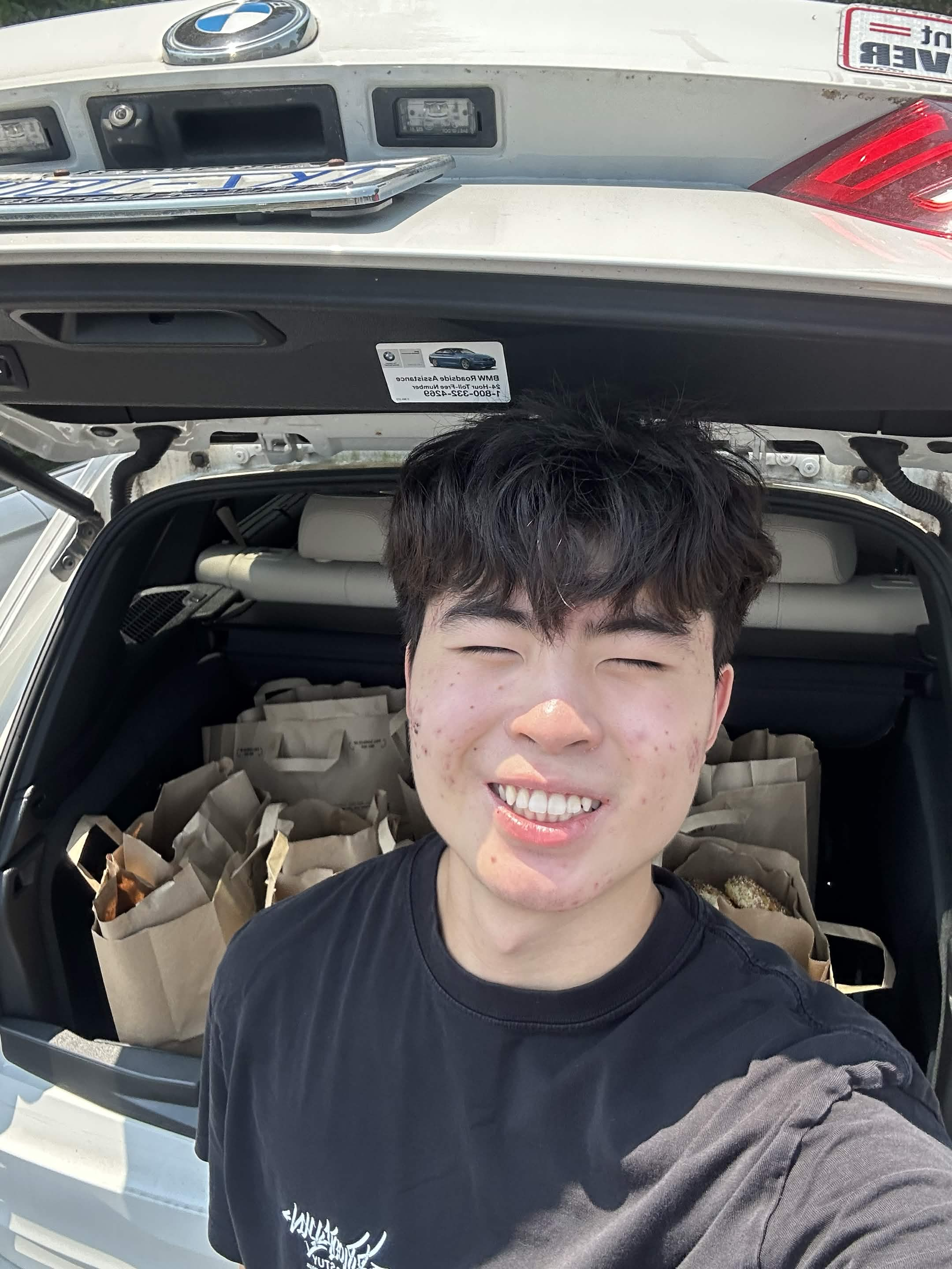 Volunteer with a car full of recovered food